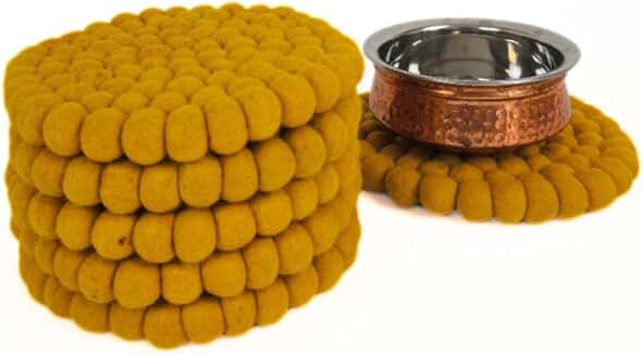 Round and square mustard-colored trivet for kitchen and dining