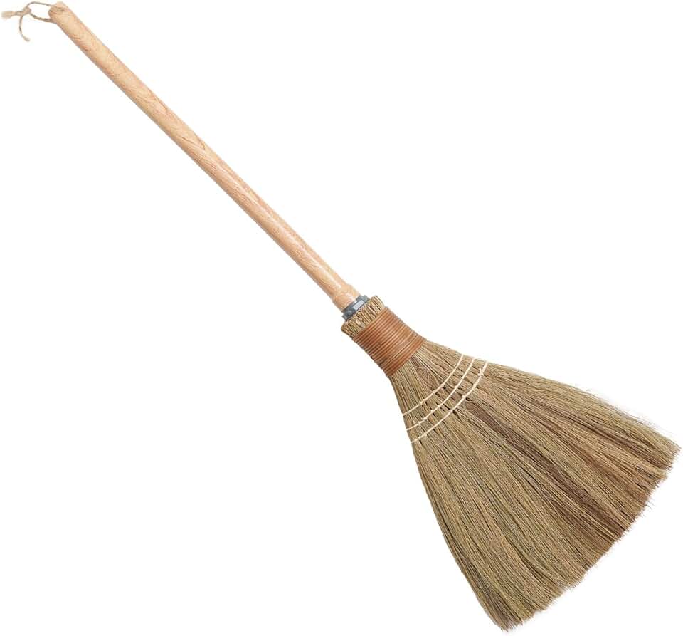 Small natural straw hand broom for indoor and outdoor cleaning