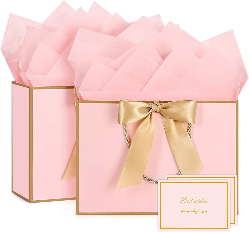 Small pink and gold gift bags with tissue and cards