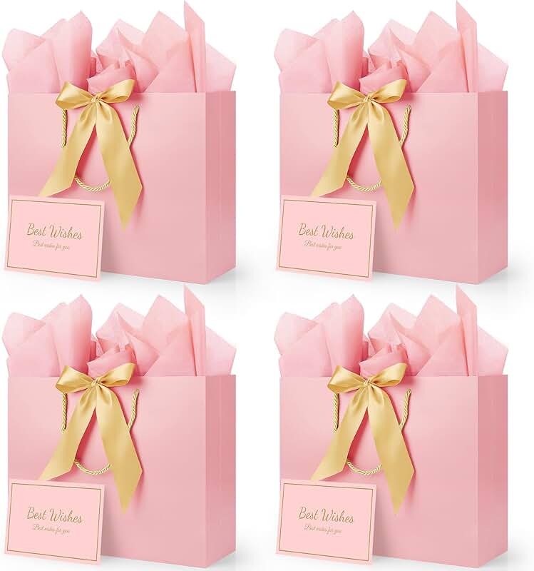 Pink gift bags with ribbons cards and tissue paper