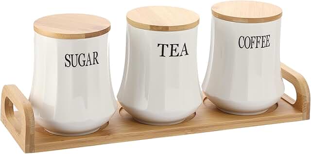 Set of three white ceramic canisters with bamboo lids