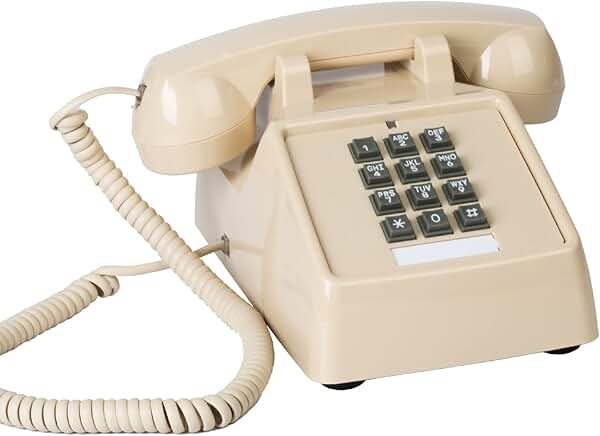 Vintage beige corded landline phone with mechanical ringer