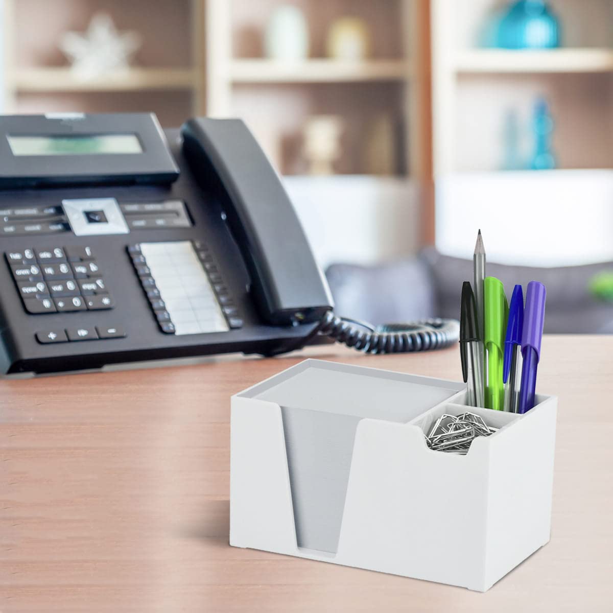 White plastic desktop organizer for pens, paper, and clips