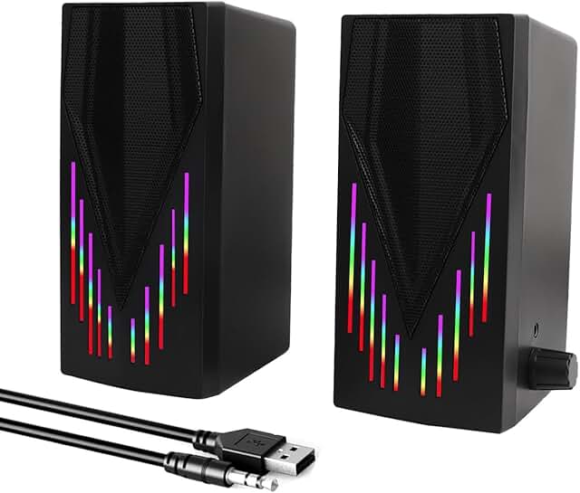 Black computer speakers with RGB lighting and aux cable