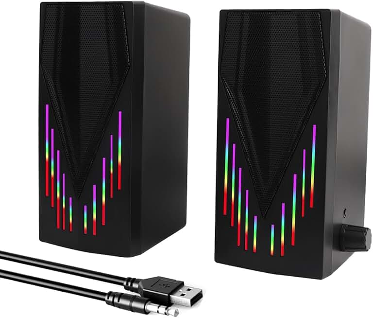 Black computer speakers with RGB lighting and aux cable