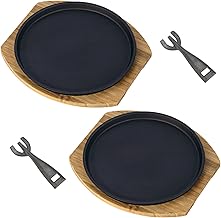 Set of two round sizzling steak plates with wooden tray
