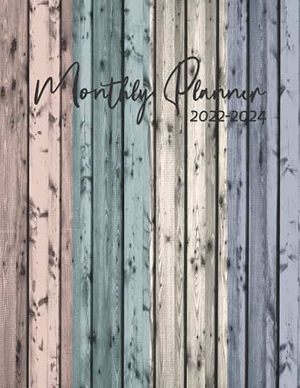 Monthly planner with 3-year calendar and holiday schedule