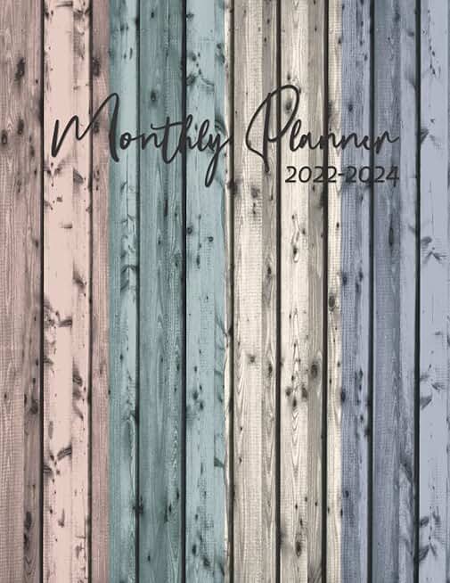 Monthly planner with 3-year calendar and holiday schedule