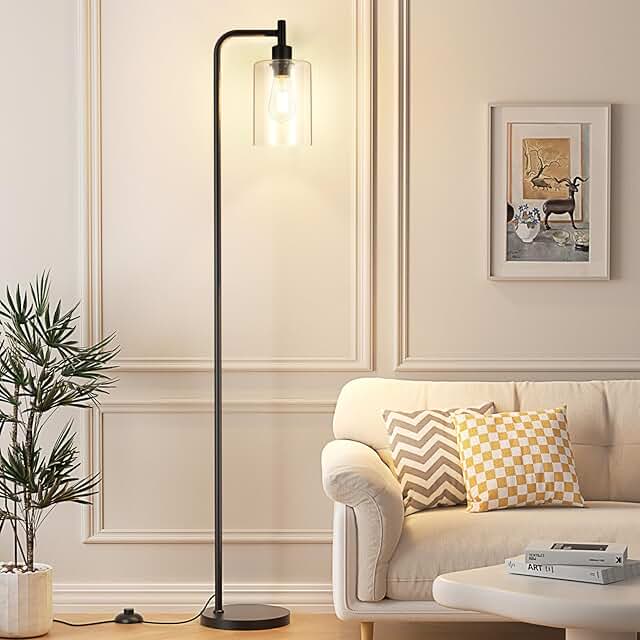Black industrial floor lamp with glass shade and foot switch