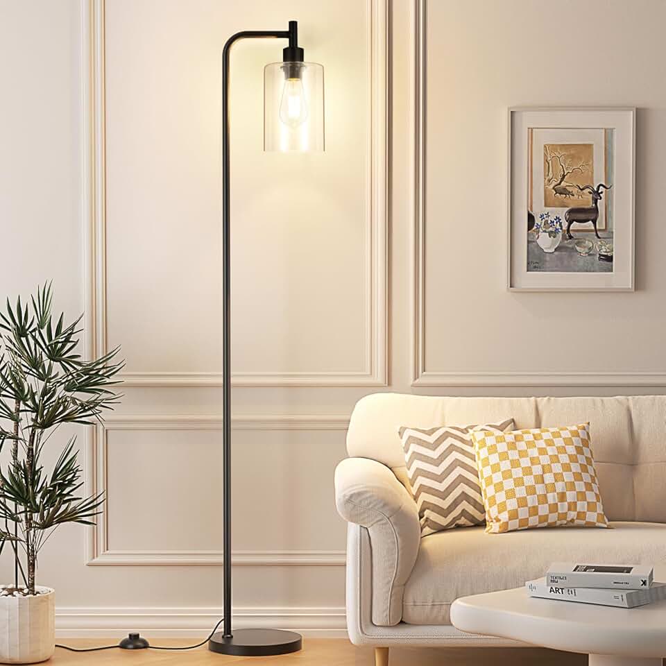 Black industrial floor lamp with glass shade and foot switch