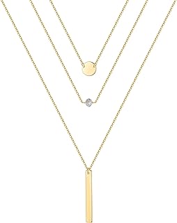 Gold layered necklaces with pearls, coins, and moon charms