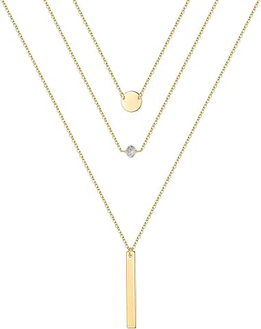Gold layered necklaces with pearls, coins, and moon charms