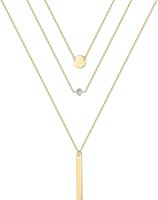 Gold layered necklaces with pearls, coins, and moon charms