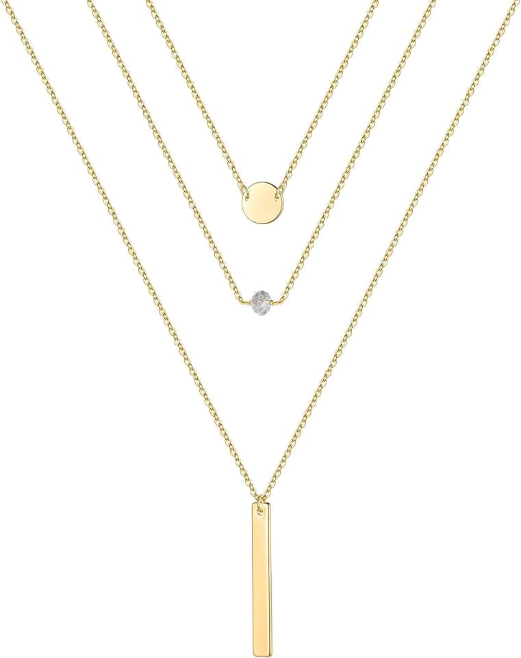 Gold layered necklaces with pearls, coins, and moon charms