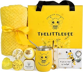 Yellow gift box with honey scent candle, soap, bath bomb, shower steamers, throw blanket, tumbler, key chain, card, and bag