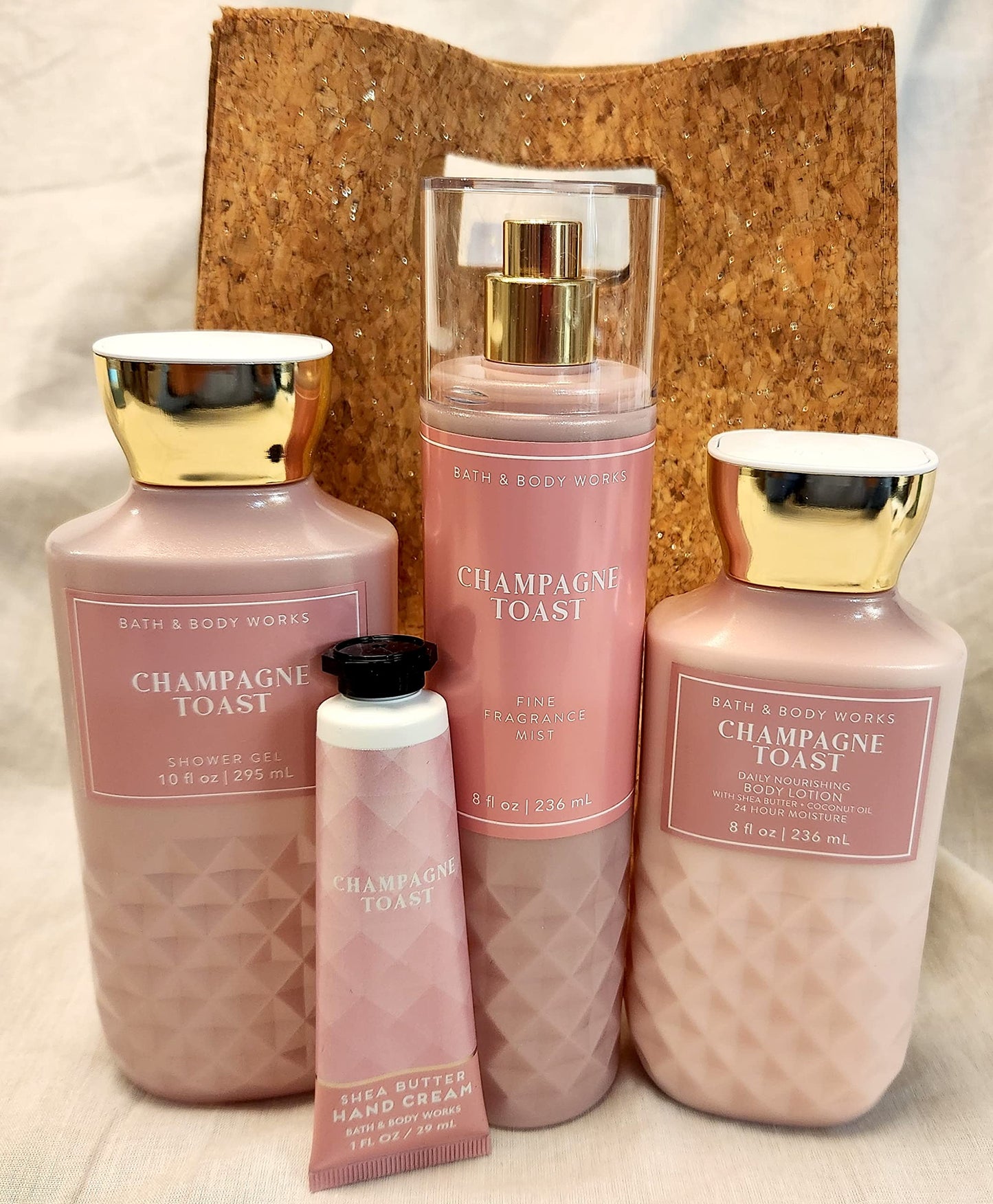 Champagne Toast Care  Full Size 4 Piece Gift set  Random Gift Bag Includes Fragrance Mist, Shower Gel, Lotion, and Hand Cream)