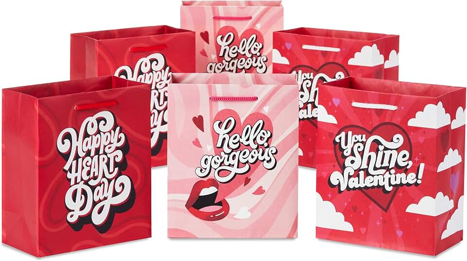 Six small Valentine's Day gift bags with three designs