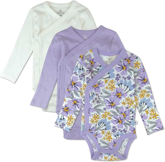 Three organic cotton long sleeve baby bodysuits