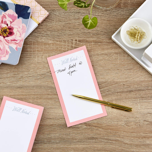 Set of three pink notepads with gold pen